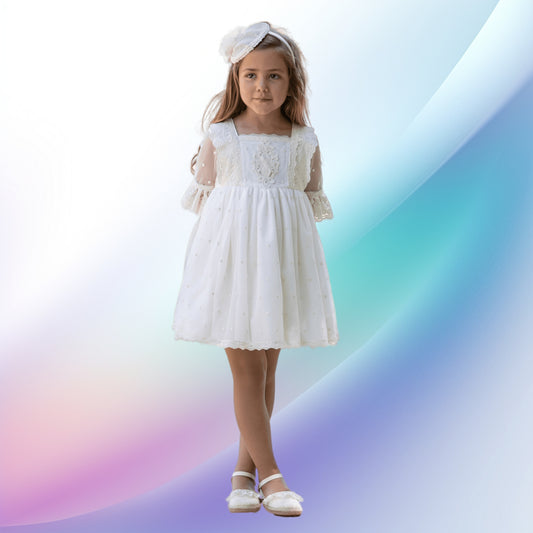Image of a graceful off-white girl's ceremony dress and diadem, ideal for weddings, church events, or first communions. The enchanting European style dress features a box neckline, intricate lace detailing, embroidered tulle sleeves, a multi-layered skirt, and a back bow. A matching headband with a bow, feather, and lace completes this beautiful flower girl ensemble.